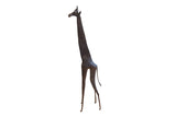 Vintage handmade African giraffe sculpture with a stylized long neck and dark patina.