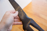 Intricate hand-carved details on the dark patinated surface of a vintage African giraffe.