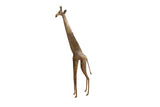 Vintage handmade African giraffe figurine with a tall slender form and aged, textured patina.