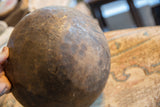 Weathered patina and aged texture on the exterior of a vintage wooden bowl.