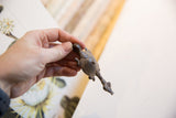 The dimensional shape and textured shell of the vintage African turtle pendant.