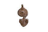 Vintage African snake pendant with a dark, rustic patina and abstract two-part form.