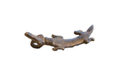 Vintage African crocodile pendant with a textured body and dark, aged metal finish.