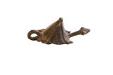 Stylized vintage African turtle pendant with a dark, patinated surface and a pyramidal shell.