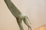 Detailed texture and patina on the hindquarters of the vintage African giraffe.