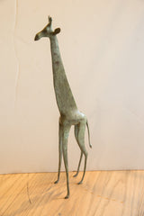 Full view of the vintage African giraffe collectible, highlighting its slender silhouette.