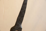 Incised foliate and crosshatch patterns on the dark vintage African giraffe.
