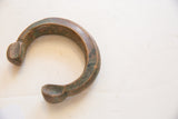 Side view highlighting the aged copper patina and form of the antique bracelet.