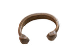 Antique African bronze snake cuff bracelet with incised geometric patterns and an aged patina.