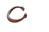 Antique African copper alloy snake cuff bracelet with an etched pattern and aged patina.