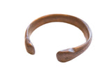 Collectible antique African copper alloy snake cuff bracelet with a warm, aged patina.