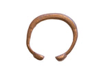 Antique African copper snake cuff bracelet with an aged patina and etched line details.