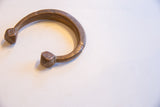 Engraved details and aged copper patina on the antique African snake cuff.