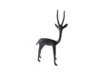 Vintage right facing African gazelle figurine with dark patina and twisted horns, 1960s era.