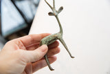Vintage African gazelle figurine with time-softened verdigris patina.