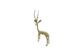 Vintage African gazelle figurine with a slender form and a bright oxidized patina.