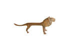 Oxidized vintage African lion figurine in profile with a mottled, weathered bronze patina.