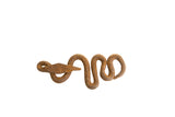 Vintage African iron snake collectible with a rough, rusted texture and winding shape.