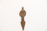 The unadorned back of the vintage snake pendant, showing its flat surface and aged patina.