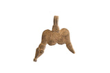 Vintage African pendant with a stylized double-headed figure and weathered patina.