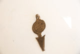 Reverse view of the vintage African pendant displaying its dark, rustic patina and texture.