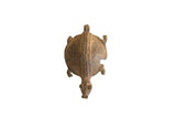 Vintage African pendant in a turtle form with a braided center detail and aged brown patina.