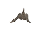 Vintage African bronze snake pendant with an abstract, winged form and a dark, textured patina.