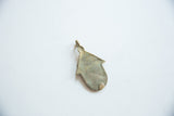 Reverse view of the vintage bronze hut pendant showing its aged, time-worn patina.