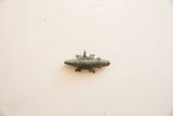 Aged patina and open-work lattice texture on a vintage African bronze crocodile pendant.