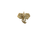Vintage African bronze elephant head pendant with a textured surface and aged patina.