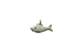 Vintage African bronze fish pendant with etched spiral patterns and a verdigris patina.