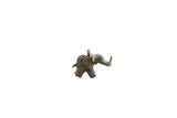 Vintage African bronze elephant pendant with a textured, oxidized patina and a raised trunk.
