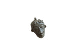 Vintage African bronze face pendant with stylized features and a dark, aged patina.