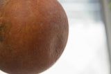 Close-up showing the warm, earthy texture of the handmade slip ware pottery.