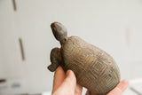 Side profile of the vintage tortoise sculpture showcasing its hand-carved details.
