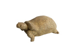 Vintage handmade African tortoise sculpture with carved geometric shell details.