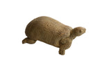 Vintage African tortoise sculpture with a textured, earthy finish and geometric shell carvings.