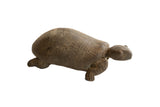 Vintage handmade African tortoise sculpture with carved geometric patterns on its earthy, textured shell.