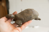 Side view of a vintage African tortoise sculpture highlighting its hand-carved details.