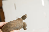 Close-up of the handmade tortoise sculpture's head with its earthy, vintage patina.