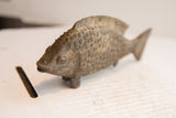 Detailed profile of the vintage fish sculpture, highlighting its textured scales and fins.