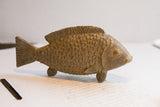 Earthy brown textured dorsal fin and scales on the vintage fish sculpture.