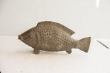 Vintage African fish sculpture, side profile showing textured scales and striated fins.
