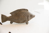 Vintage African fish sculpture with dark brown, textured, handmade body.