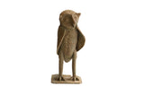 Vintage African owl sculpture with a stylized form and a rough, earthy texture.