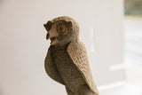 Angled view of the vintage owl's textured head, showing its distinct beak and eyes.