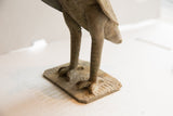 Carved feet and textured square base of the vintage African owl sculpture.
