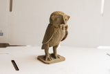 Side profile of the vintage handmade African owl with rat sculpture.