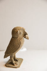 Vintage African owl sculpture in profile, showing its hand-carved rustic textures.