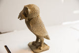Vintage African owl sculpture with rat, showing its textured form and carved wings in profile.